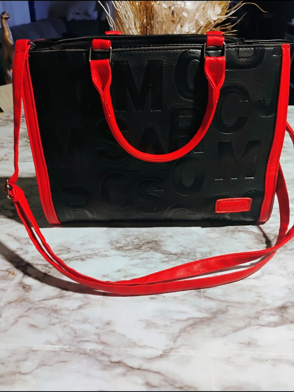 Women’s Black Satchel with Red Trim and Embossed Logo